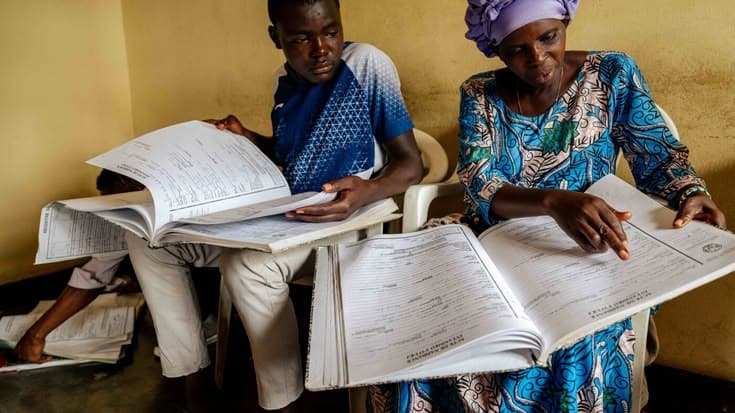 A family reviewing paper health records